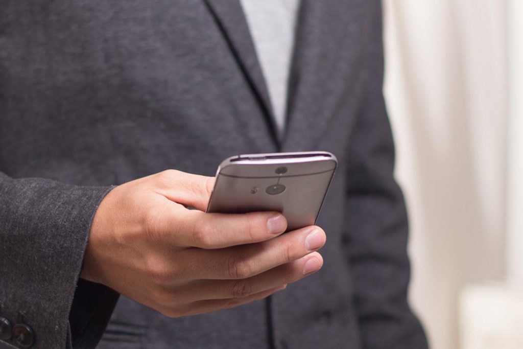 man looking at phone