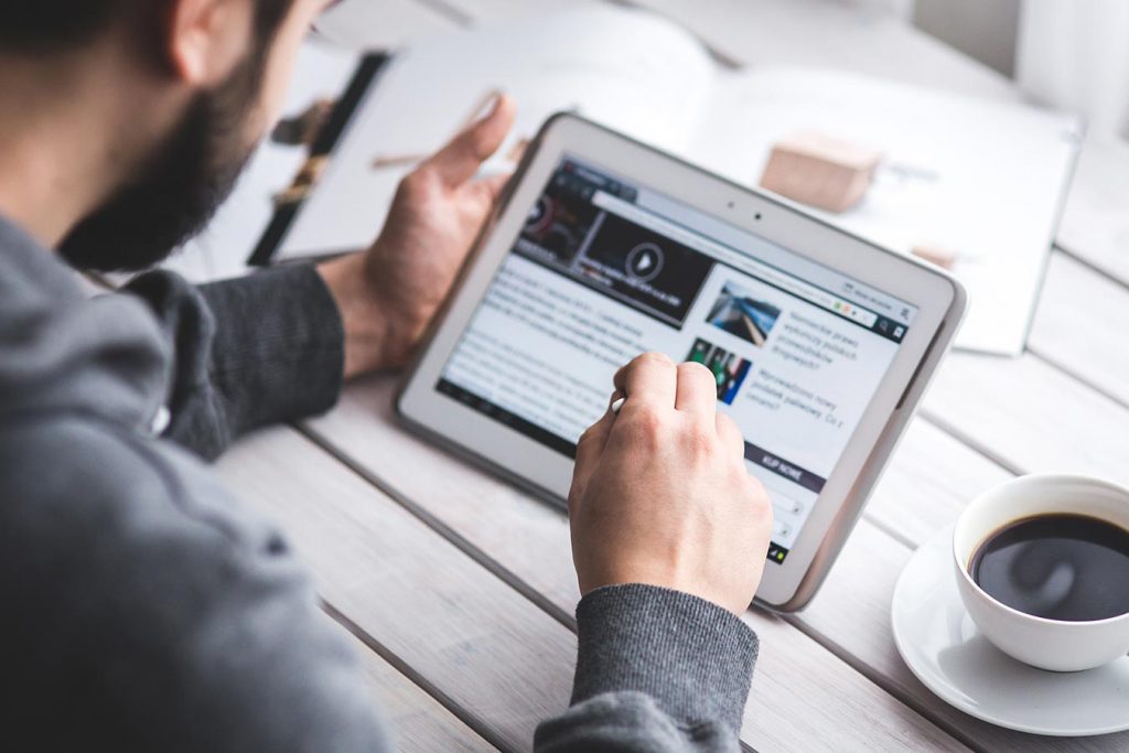 tablet with news on screen